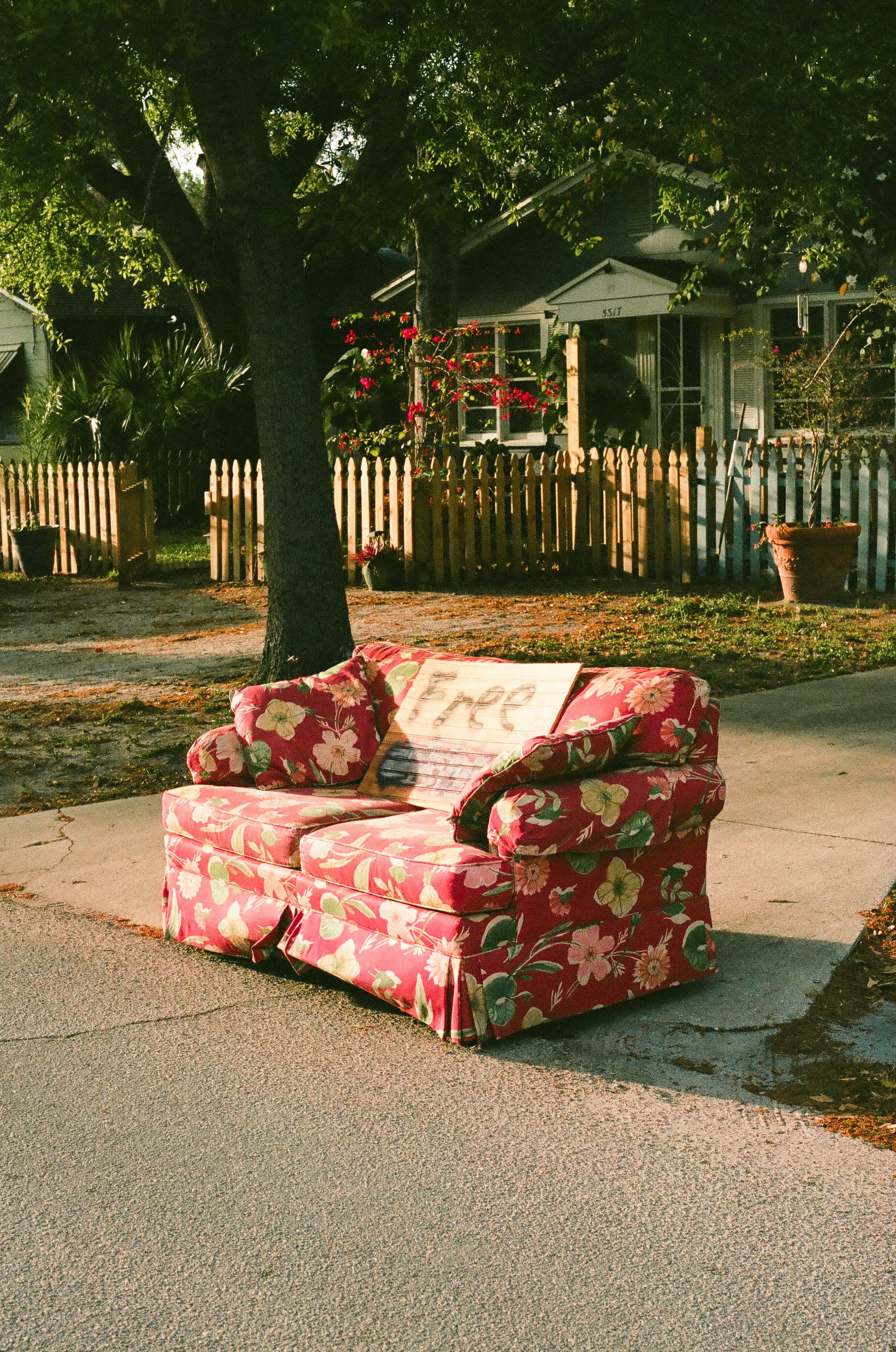 red and white floral sofa chair